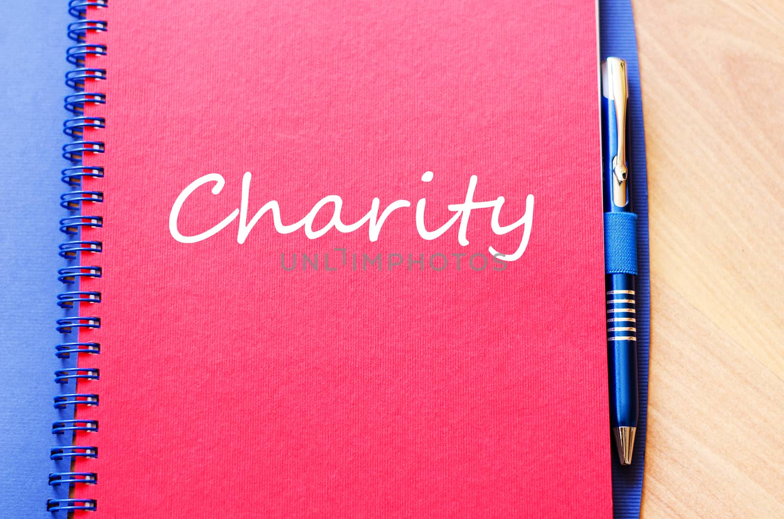 Charity text concept write on notebook