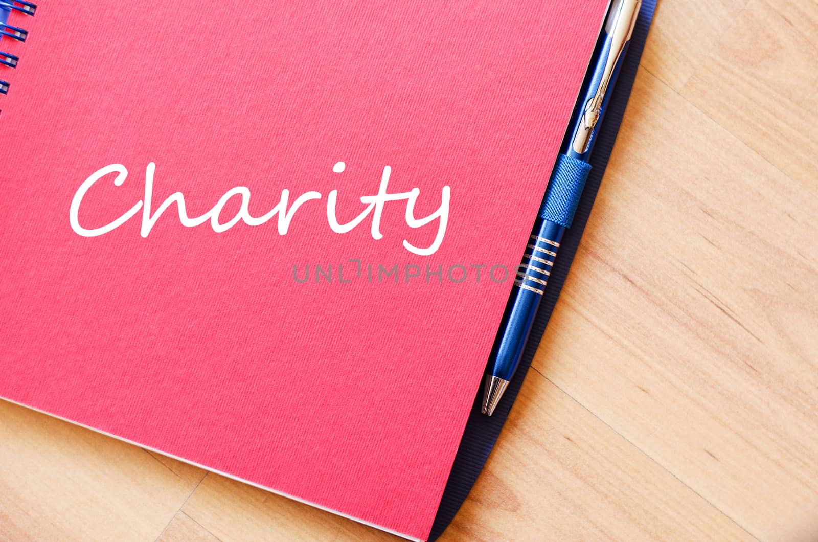 Charity text concept write on notebook