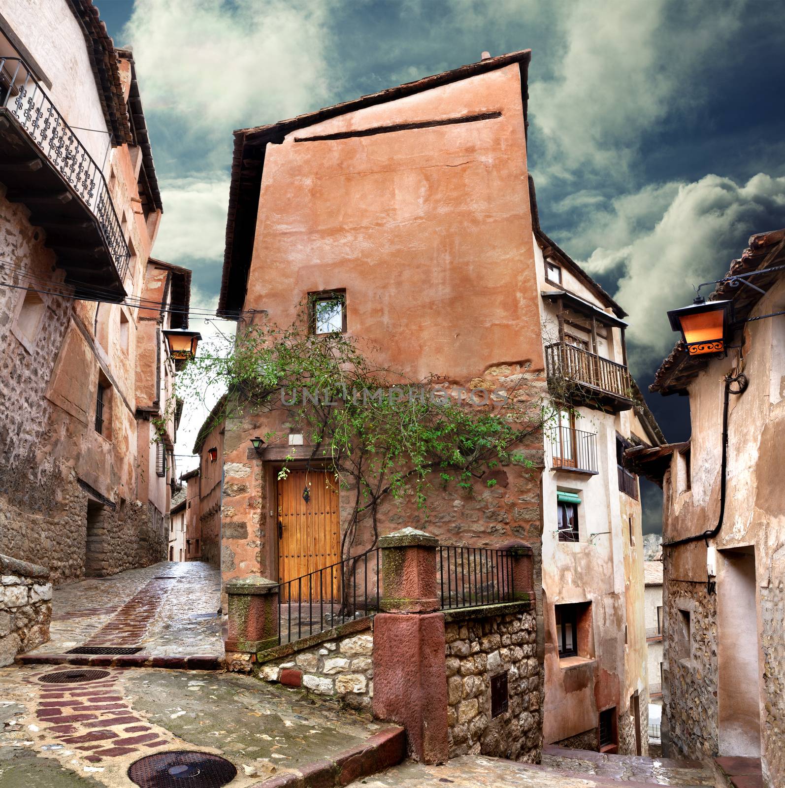 Surreal house and cobblestone village street at evening