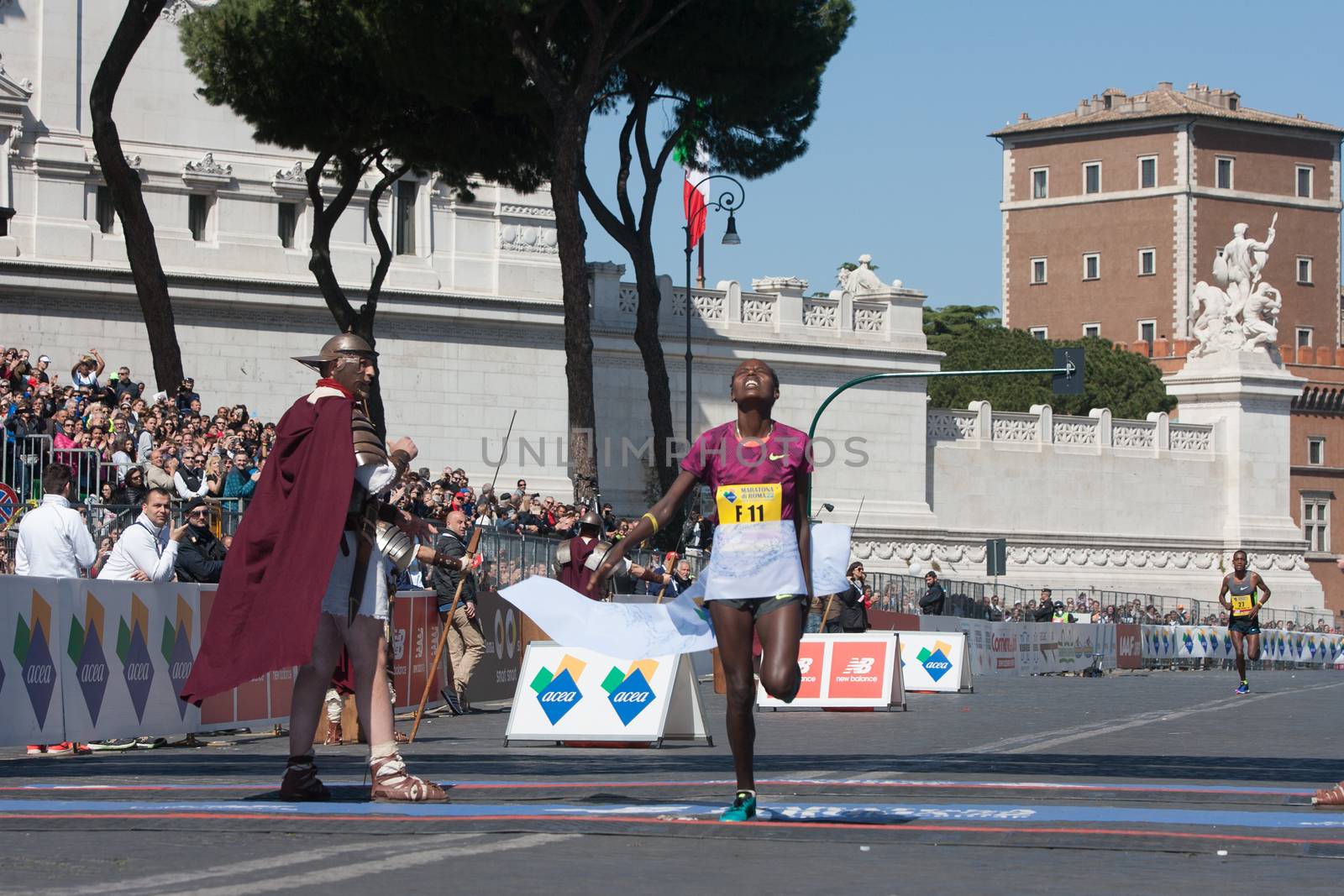 ITALY, Rome: Ethiopian runner Rahma Tusa crosses the finish line of Rome City Marathon  in Rome on April 10, 2016. She won the women first position in 2h28'49.