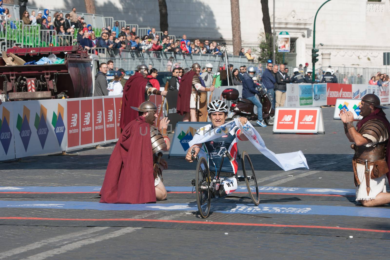 ITALY, Rome: Italian handbiker and former Formule 1 pilot Alexandro Zanardi crosses the finish line of Rome City Marathon in Rome on April 10, 2016. He won the first position in the handisport category with a new record of 1h09'15.