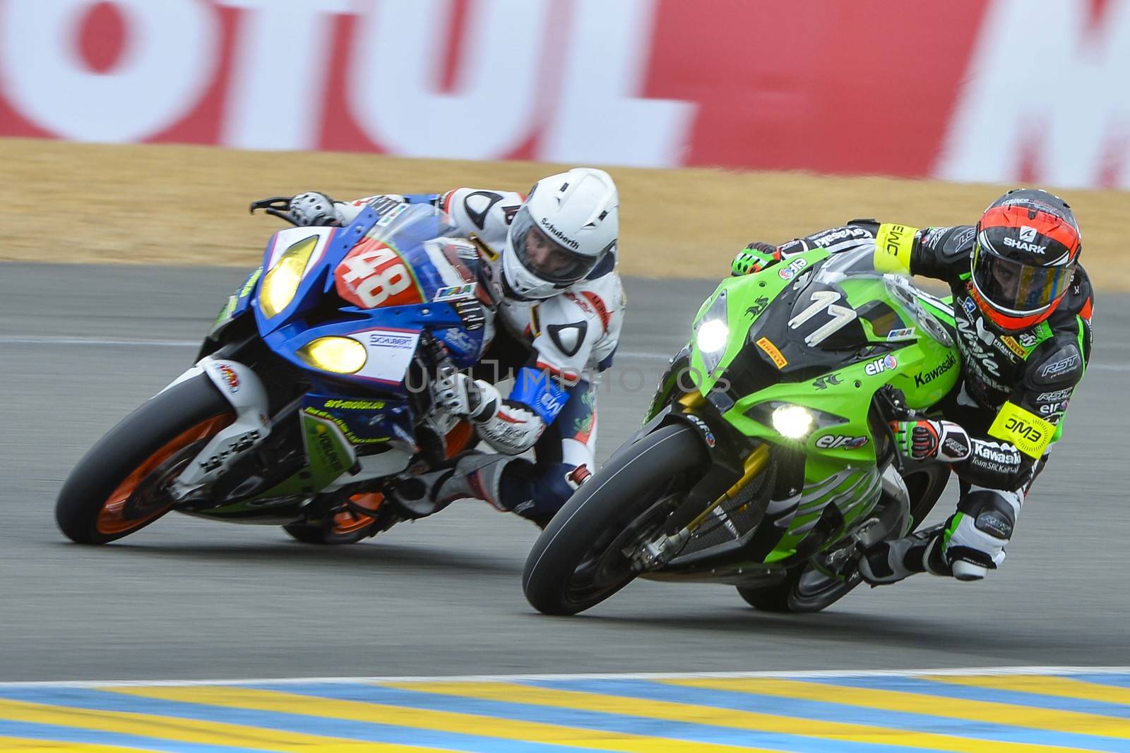 FRANCE, Le Mans: French 11 Kawasaki SRC team pilot (R) is pictured next  during the 39th edition of le Mans 24 hours moto endurance race on April 10, 2014 in Le Mans, western France. French team Leblanc-Lagrive-Foret on Kawasaki N.11 won the race.