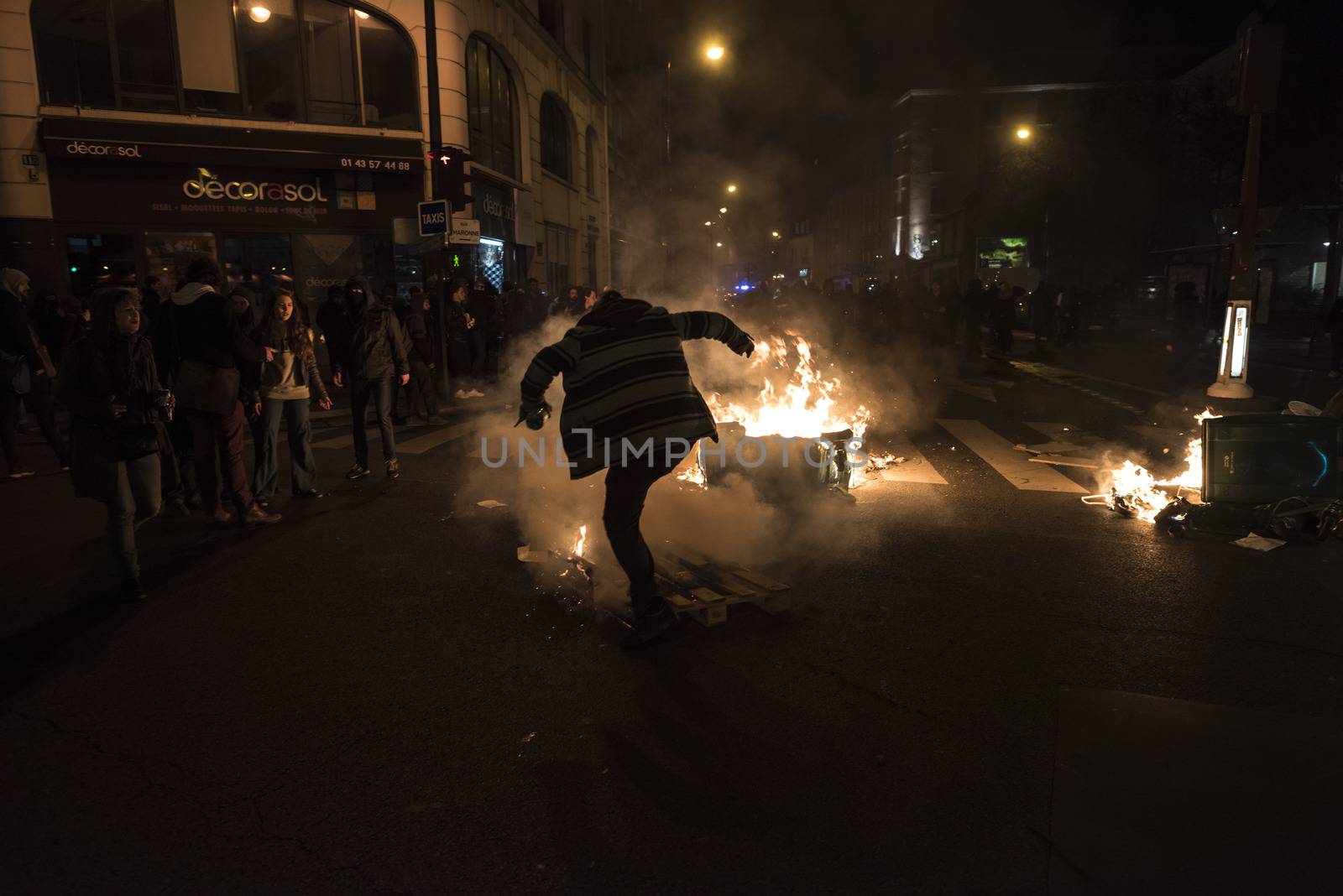 FRANCE, Paris: Palets and dust bins burn in Paris, as Nuit Debout militants hold a spontaneous demonstration to reach French Prime minister Manuel Valls residence on April 9, 2016. 