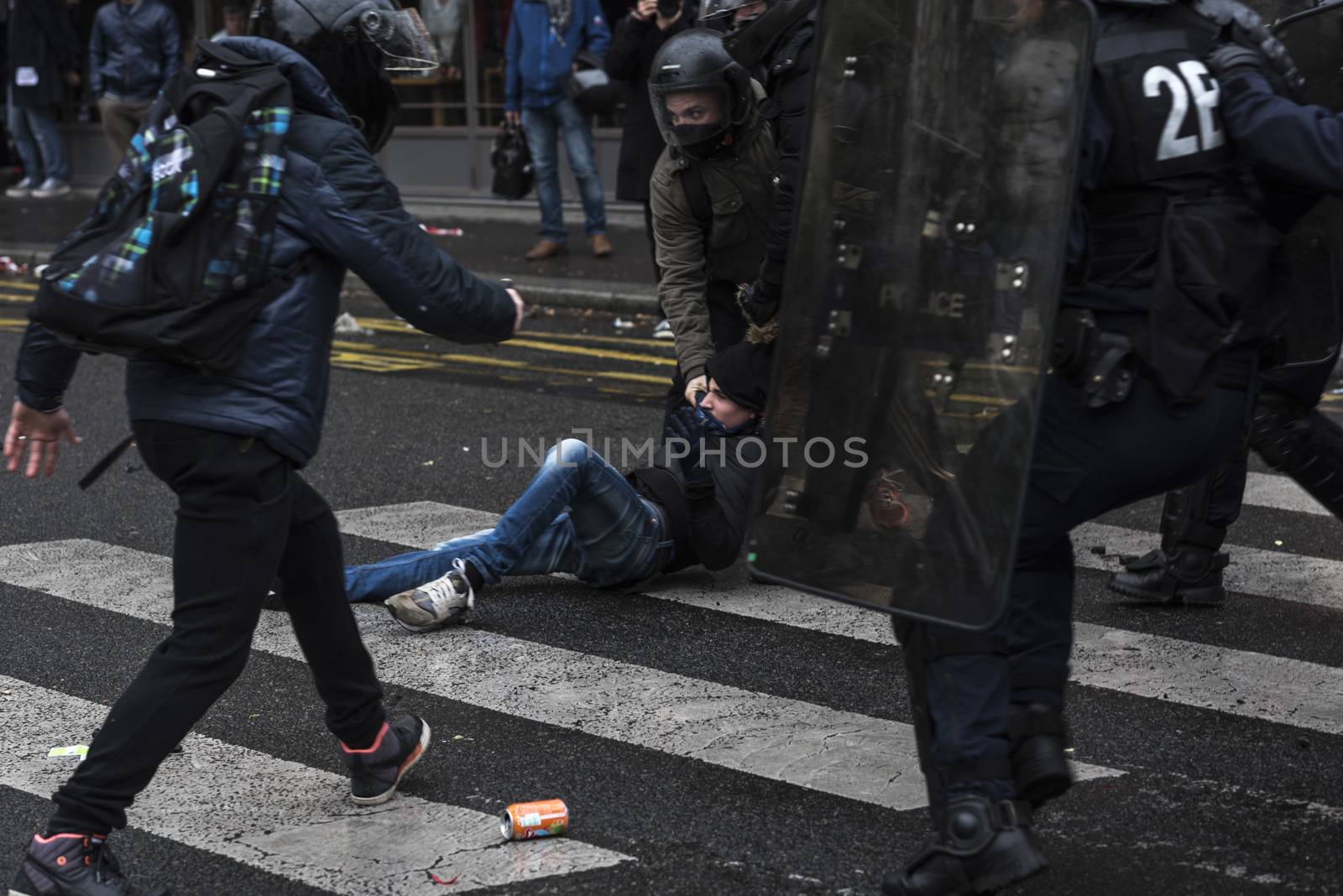 RANCE, Paris: Riot policemen run over a protester during a demonstration against labour reform in Paris on April 9, 2016.