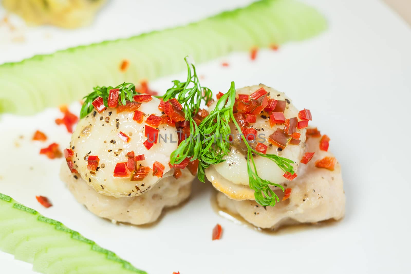 Scallop sprinkled with chili chopped and coriander by nopparats