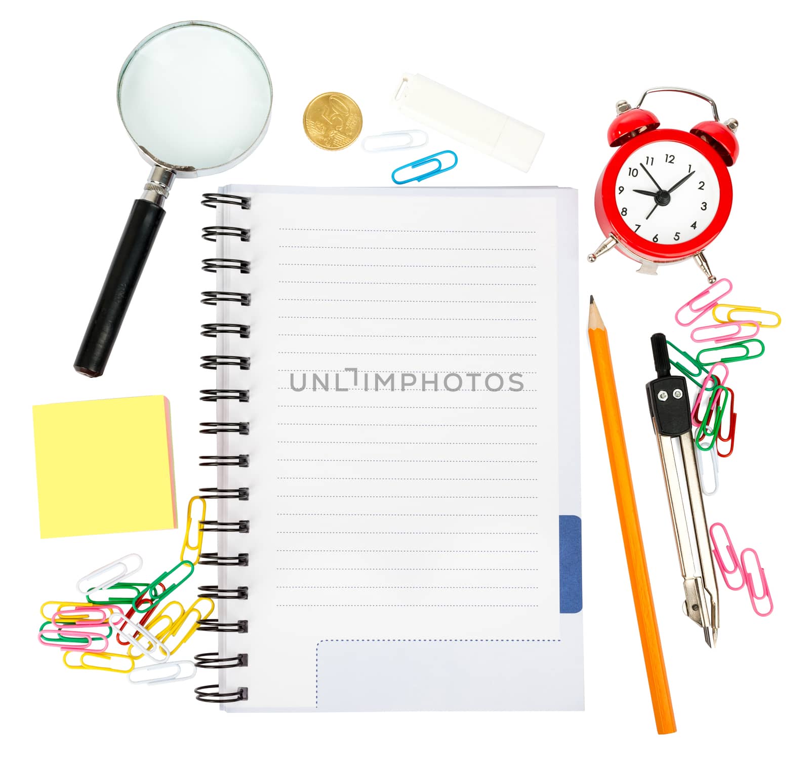 Open notebook with stationery and alarm clock isolated white background, closeup