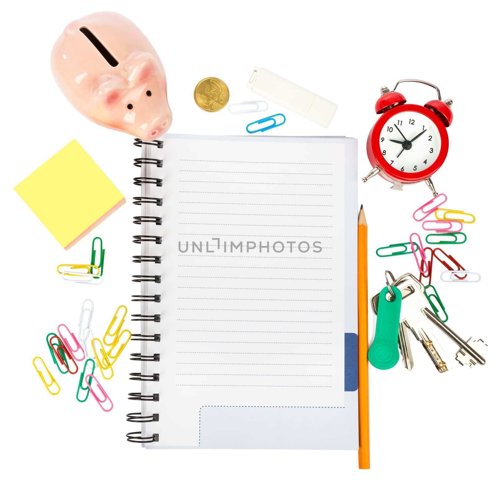 Open notebook with stationery and piggy bank isolated white background, closeup