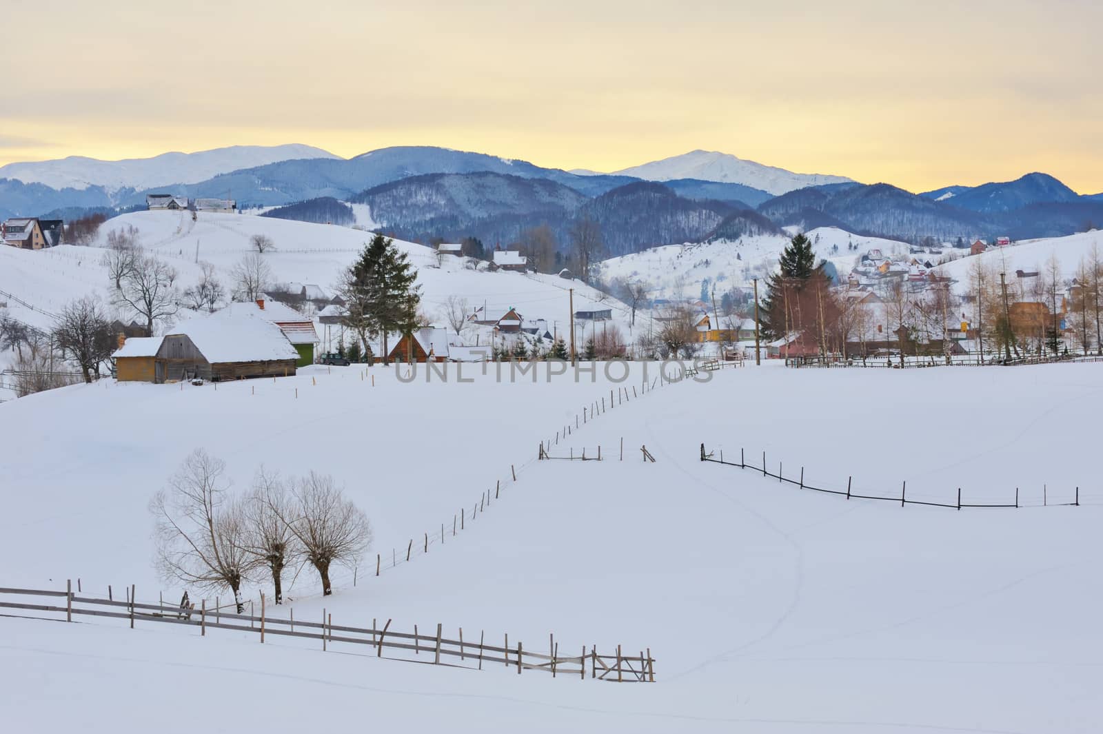 Winter romanian village and  mountain landscape