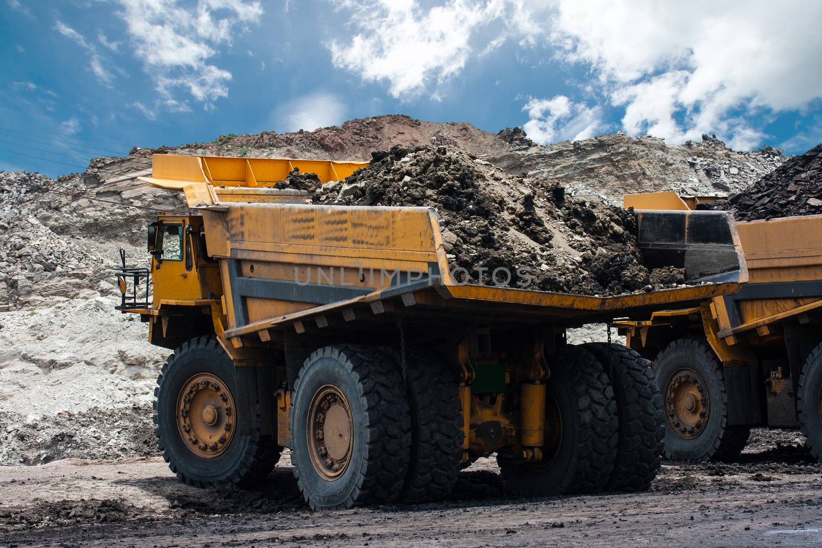 big yellow mining truck at work site