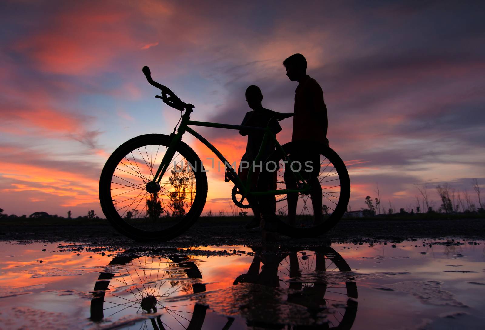 silhouette of a bicycle at sunset