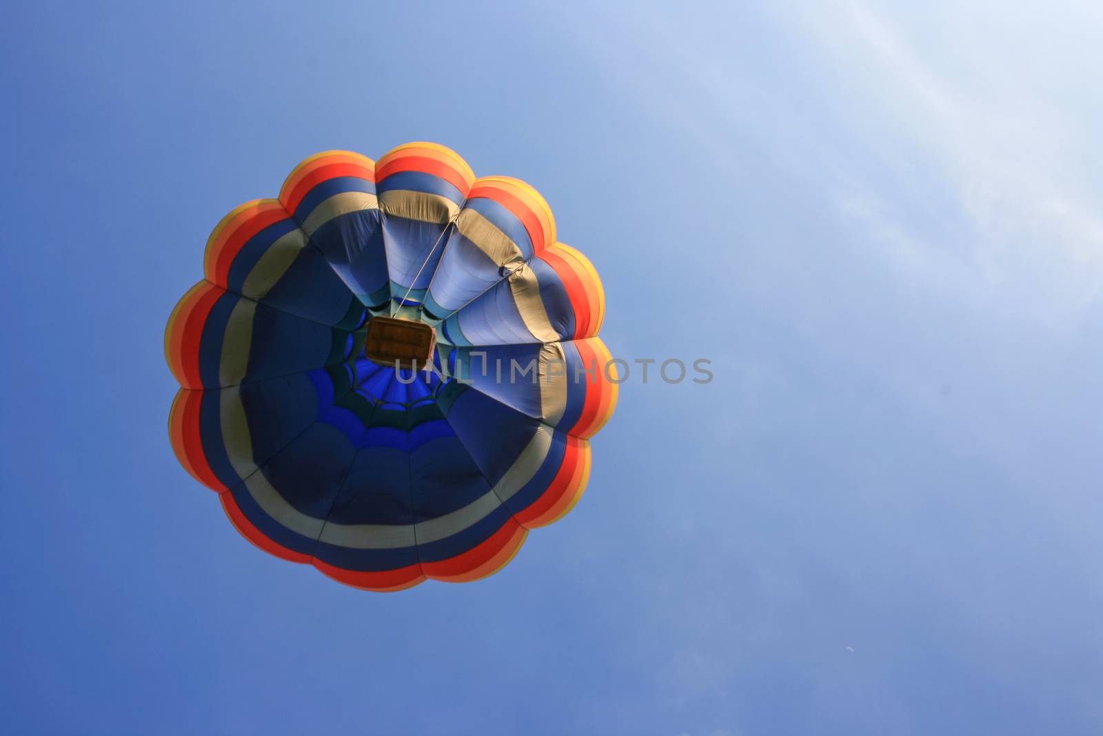 Colorful hot air balloon with blue sky background