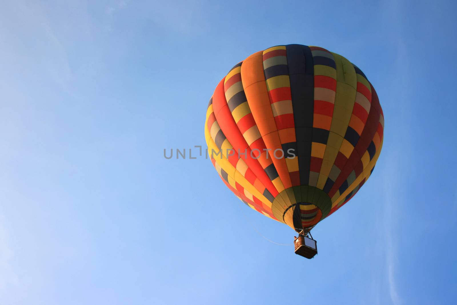 Colorful hot air balloon with blue sky background