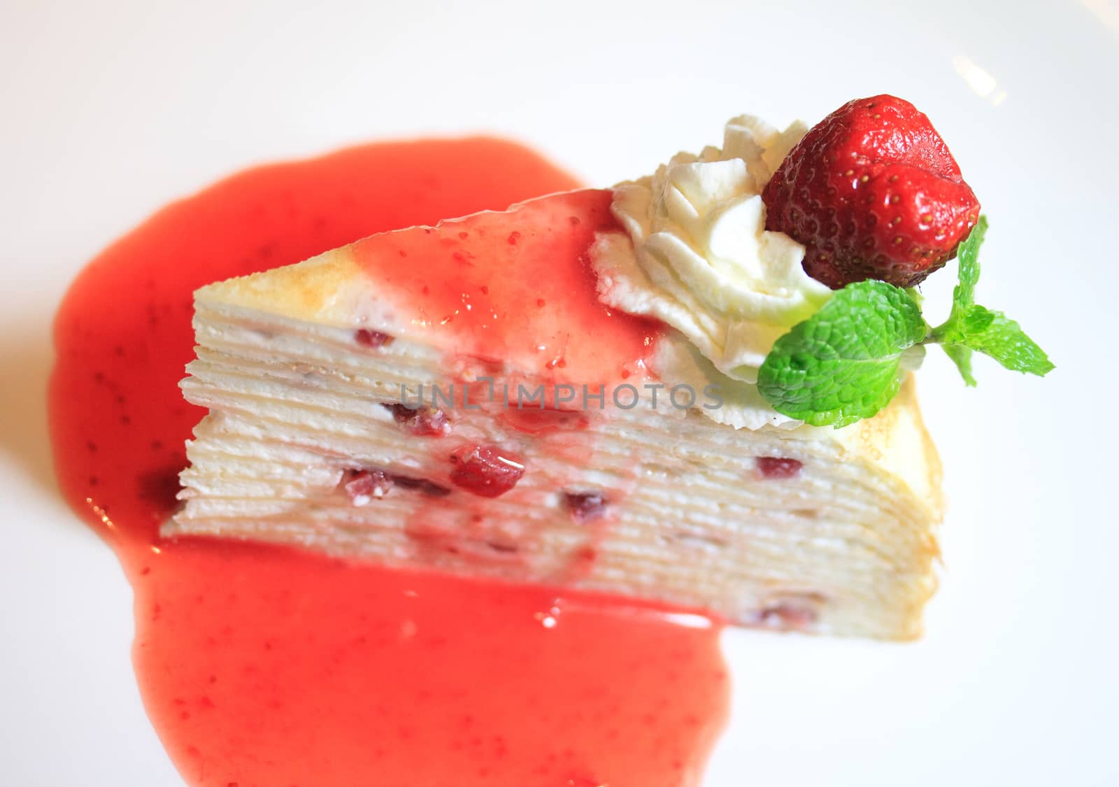 Strawberry cheesecake on table background