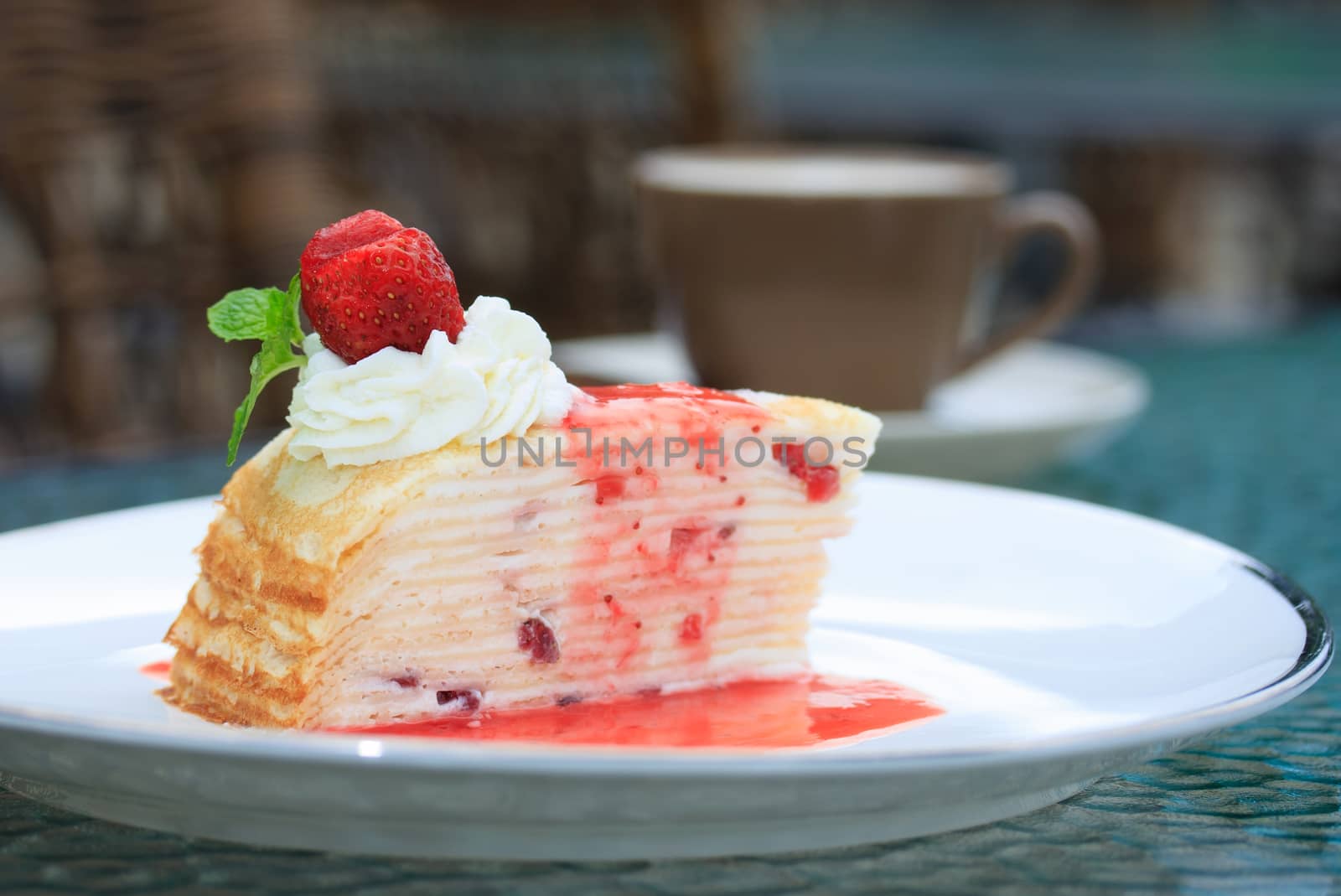 Strawberry cheesecake on table background