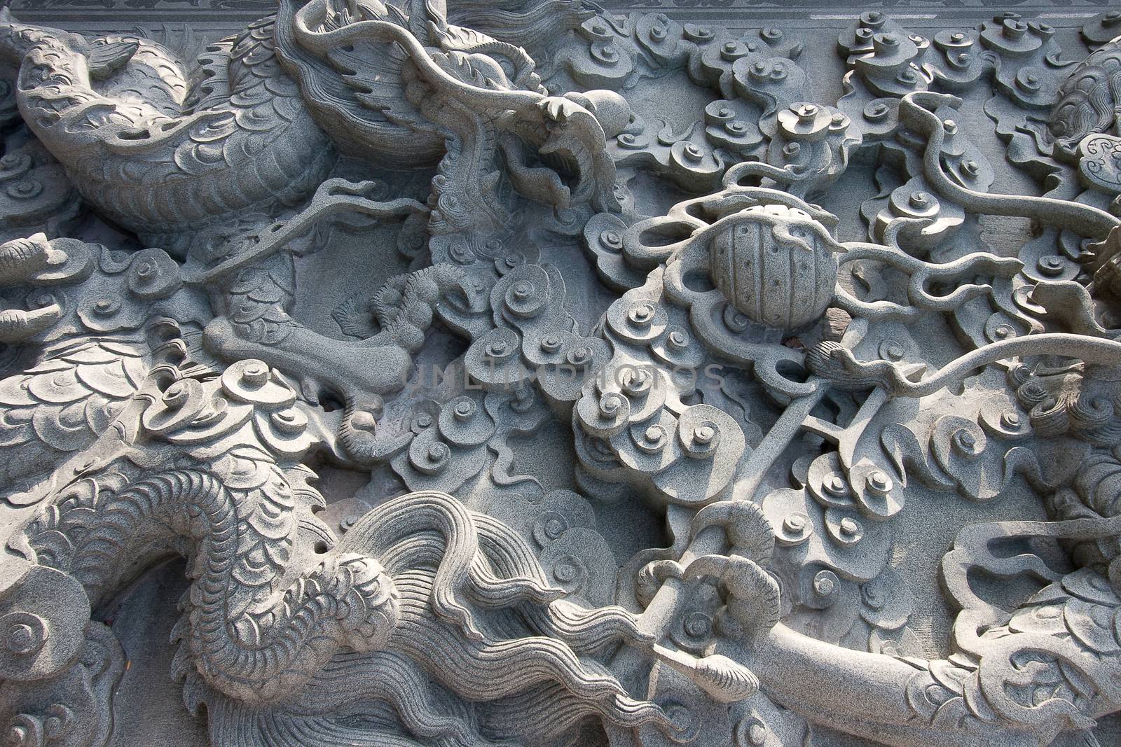 Chinese dragons on granite wall texture