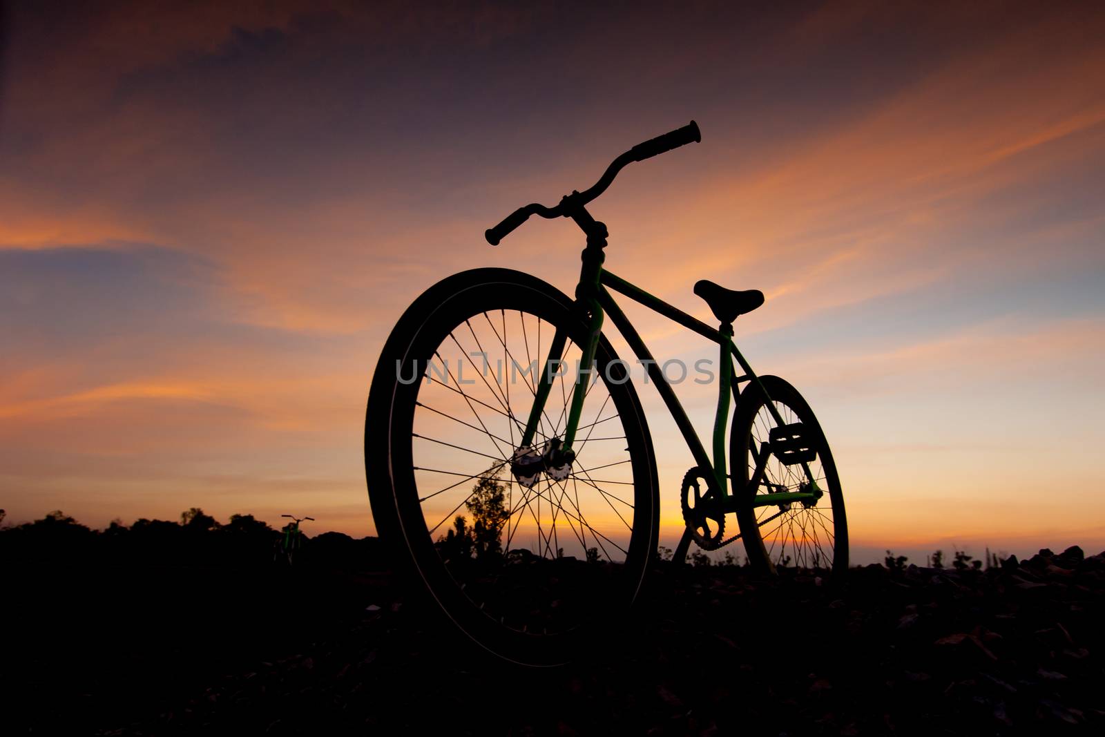 silhouette bicycle in sunset by pkproject