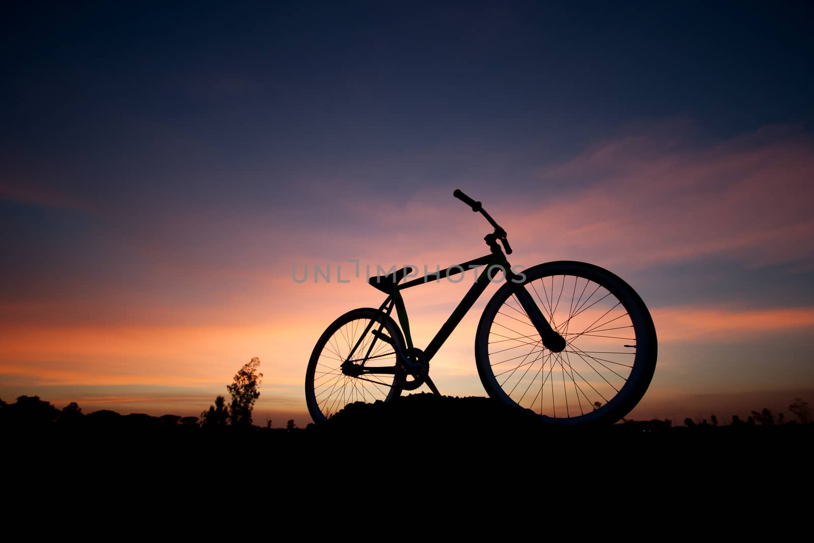 silhouette bicycle in sunset by pkproject