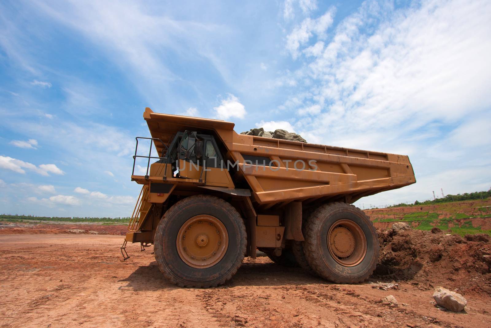 big yellow mining truck at work site