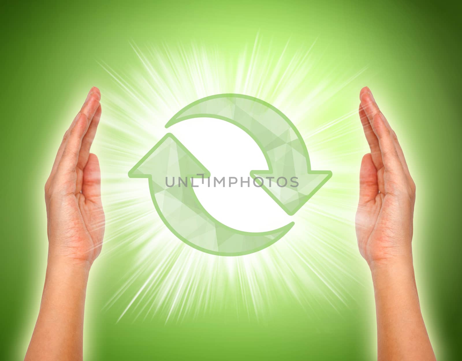 Hands with recycle icon in the middle, Conceptual image. by pkproject