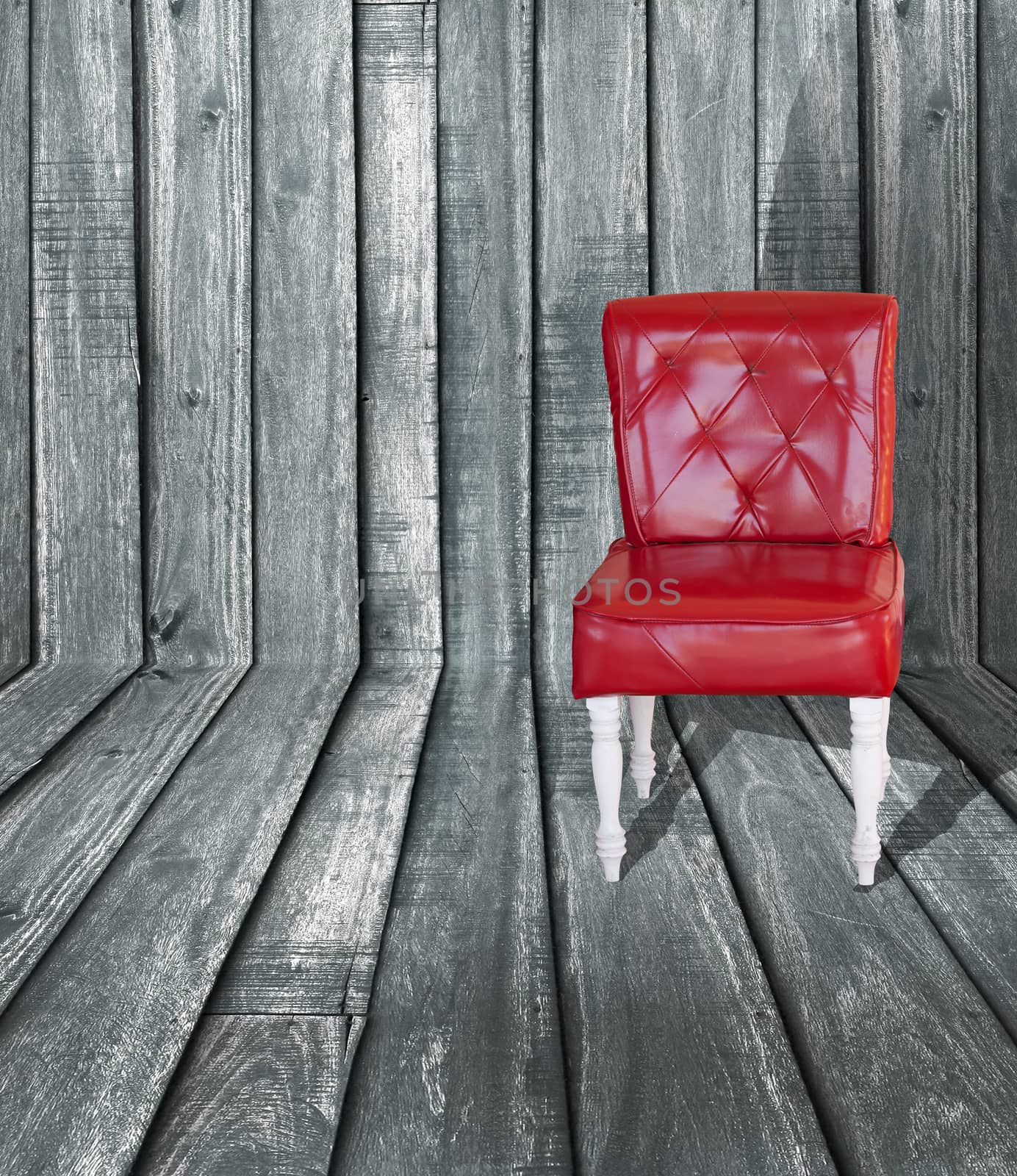 red vintage leather chair on perspective wooden floor