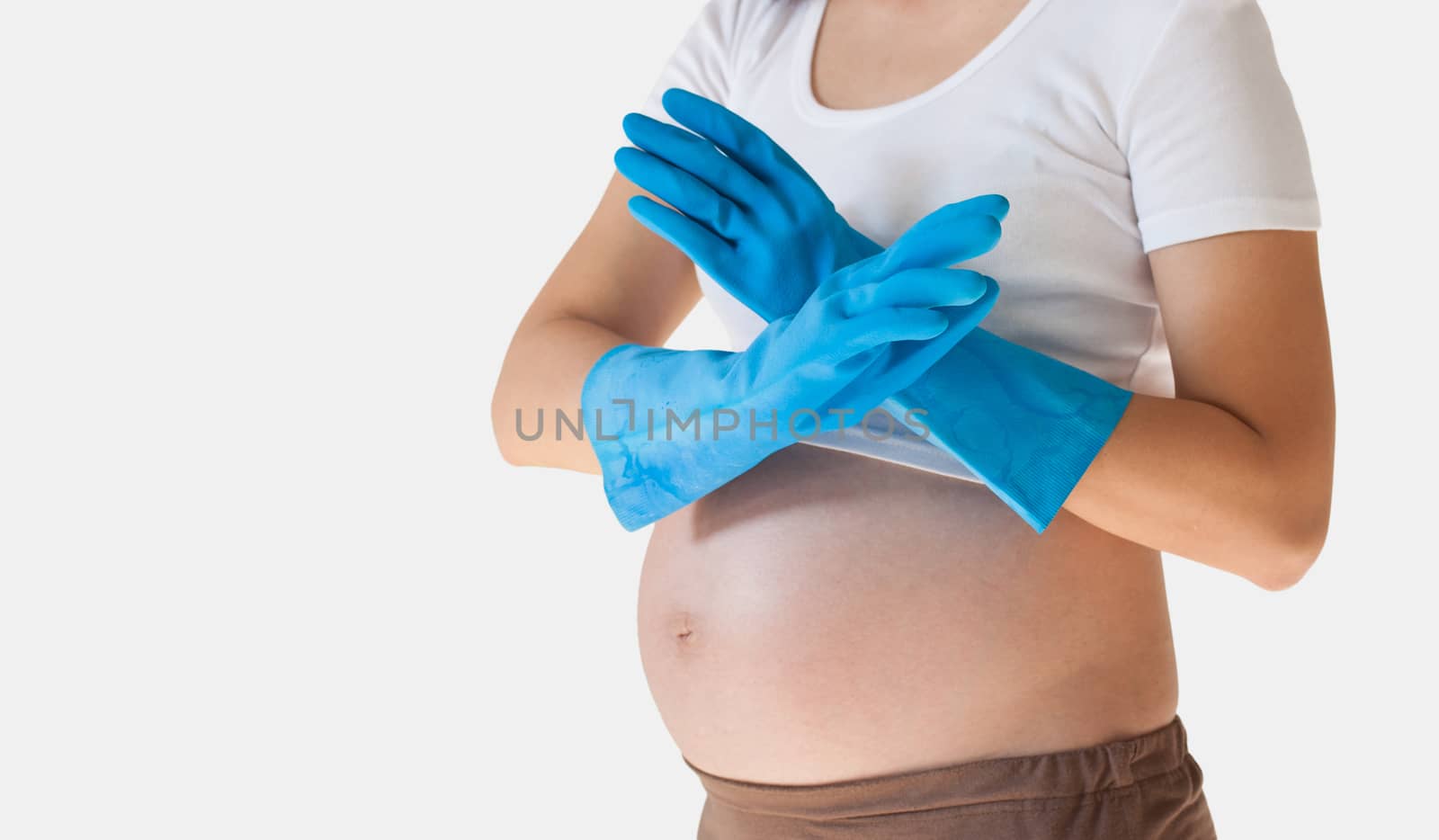 pregnant woman in the cleaning gloves isolated over white backgr by pkproject
