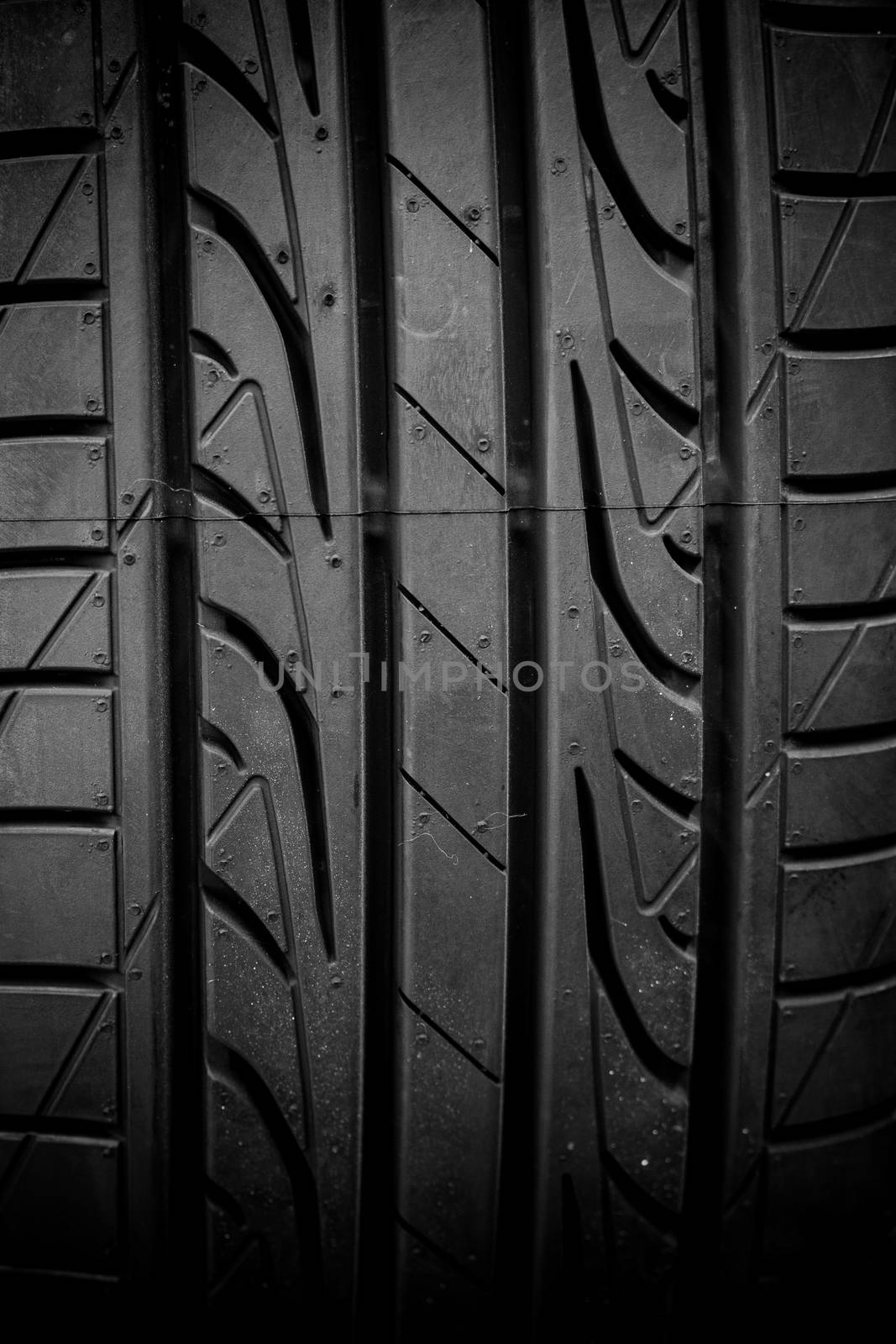 Winter tires close-up on black background