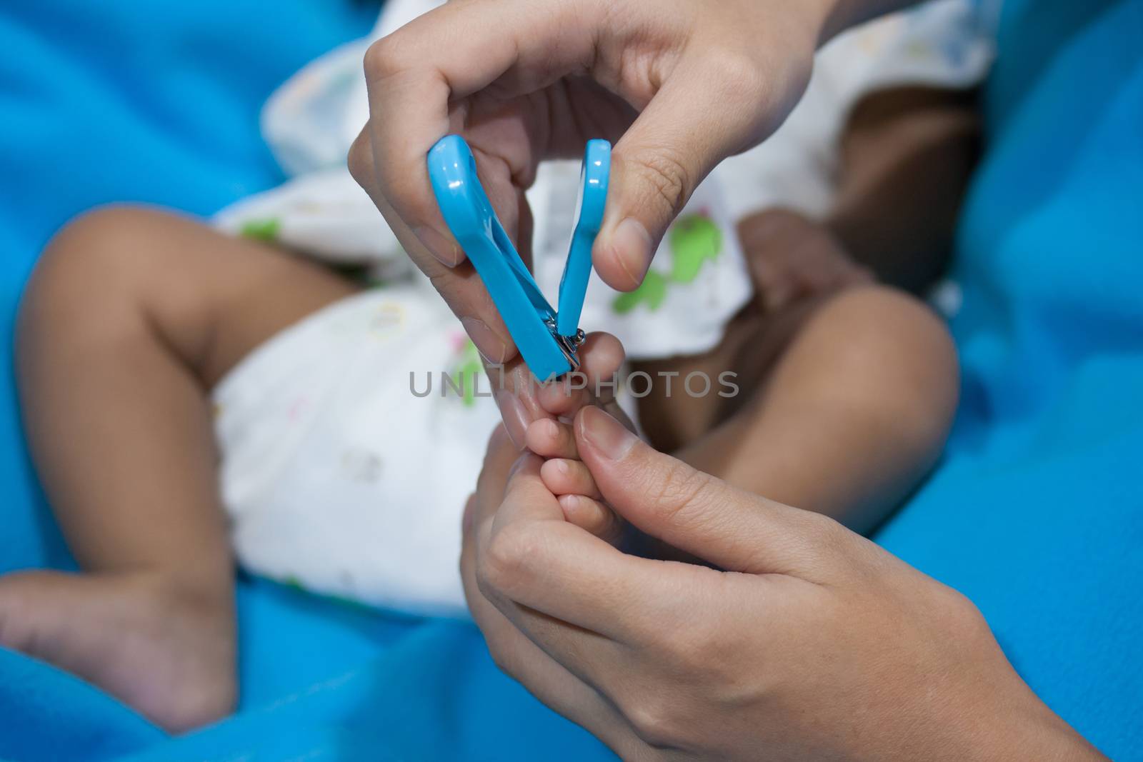  mum cutting babies nails by pkproject