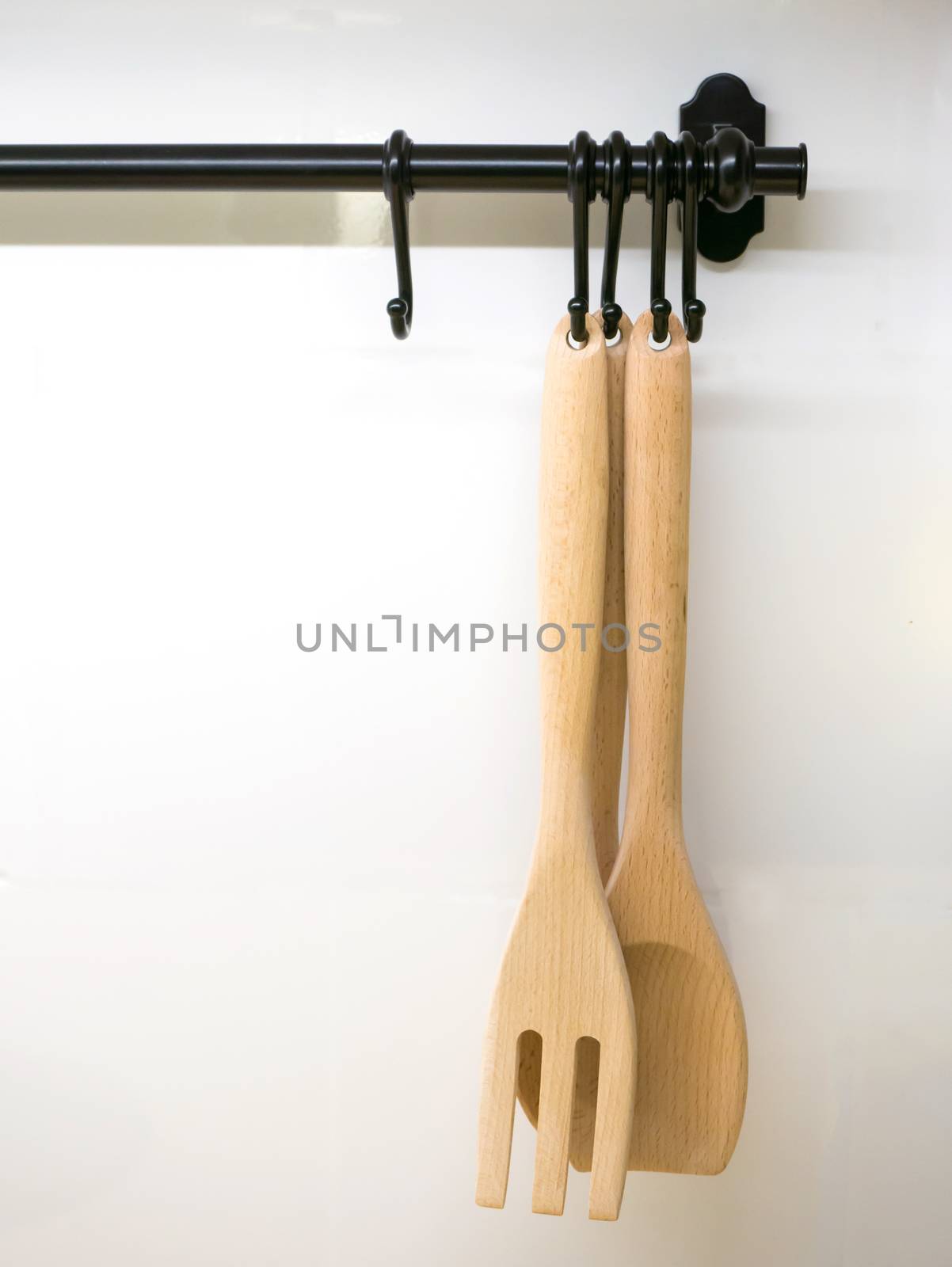 Wood turner in the kitchen on white wall background
