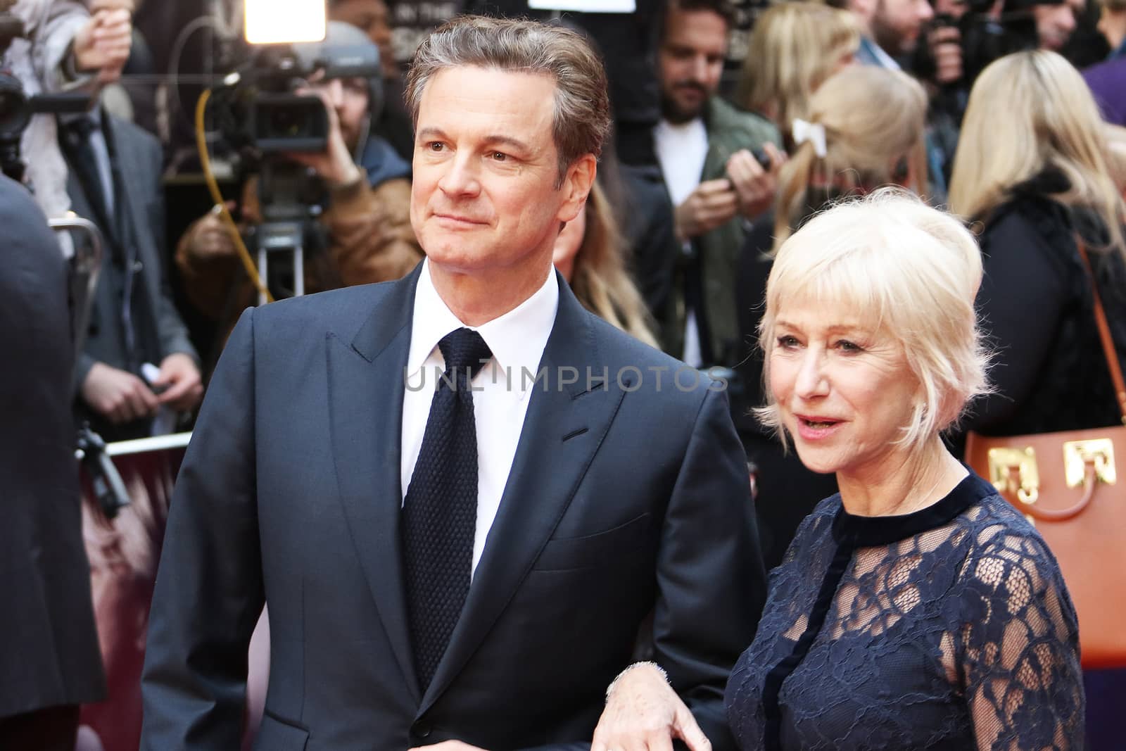 UK, London: Colin Firth and Helen Mirren pose on the red carpet on April 11, 2016 before the premiere of Eye in the Sky at Curzon Mayfair Cinema in London.