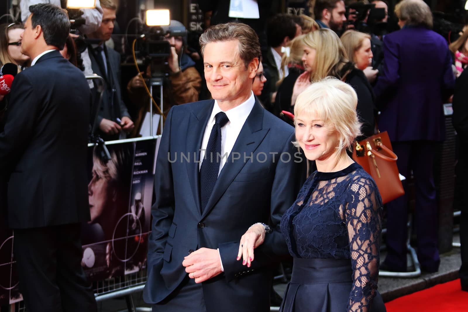 UK, London: Colin Firth and Helen Mirren pose on the red carpet on April 11, 2016 before the premiere of Eye in the Sky at Curzon Mayfair Cinema in London.