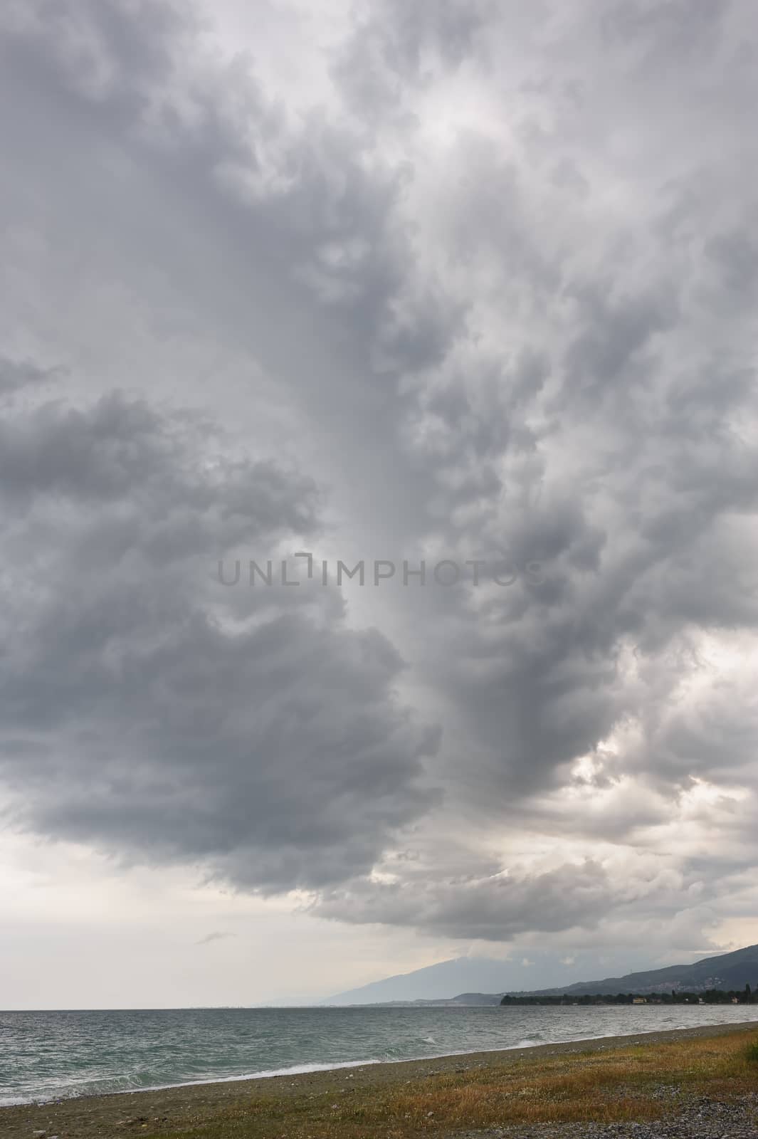 rainstorm, heavy overcast raiclouds over the sea