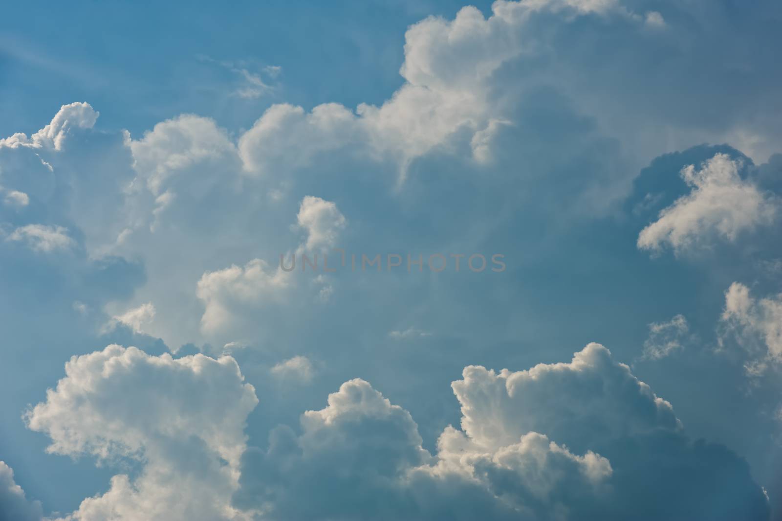 Large fluffy cloud relief details on blue sky