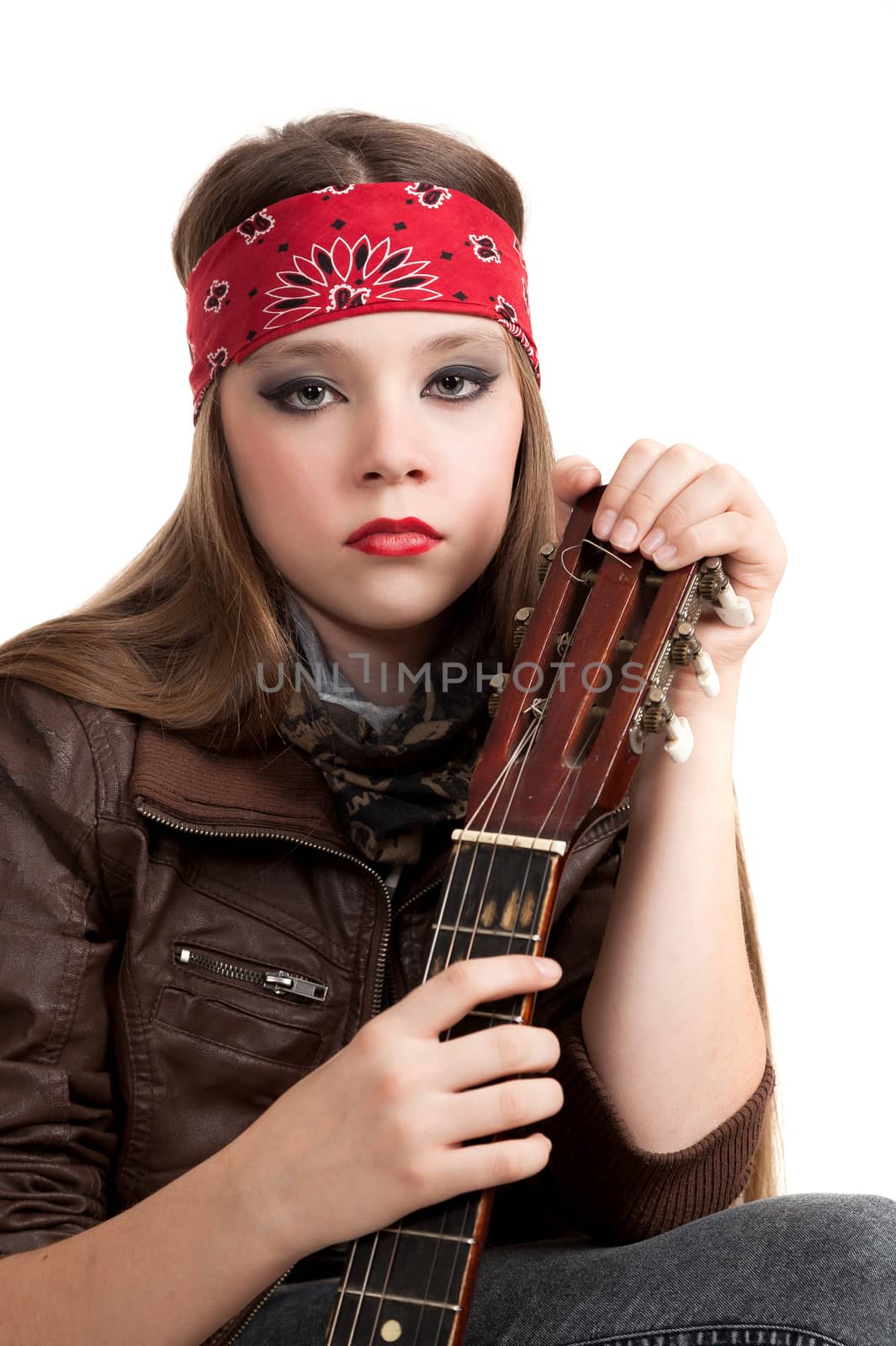 the girl the teenager in a leather jacket with a guitar on a white background