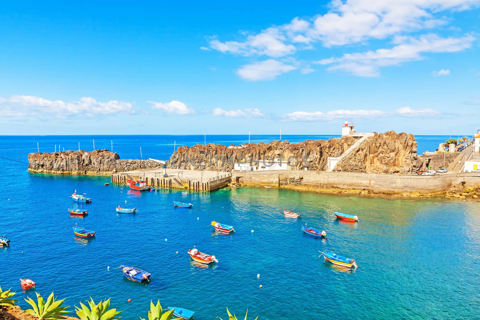 Camara de Lobos, Madeira - June 8, 2013: Port with fishing boats. The village is typical for its cat shark drying under the sun.