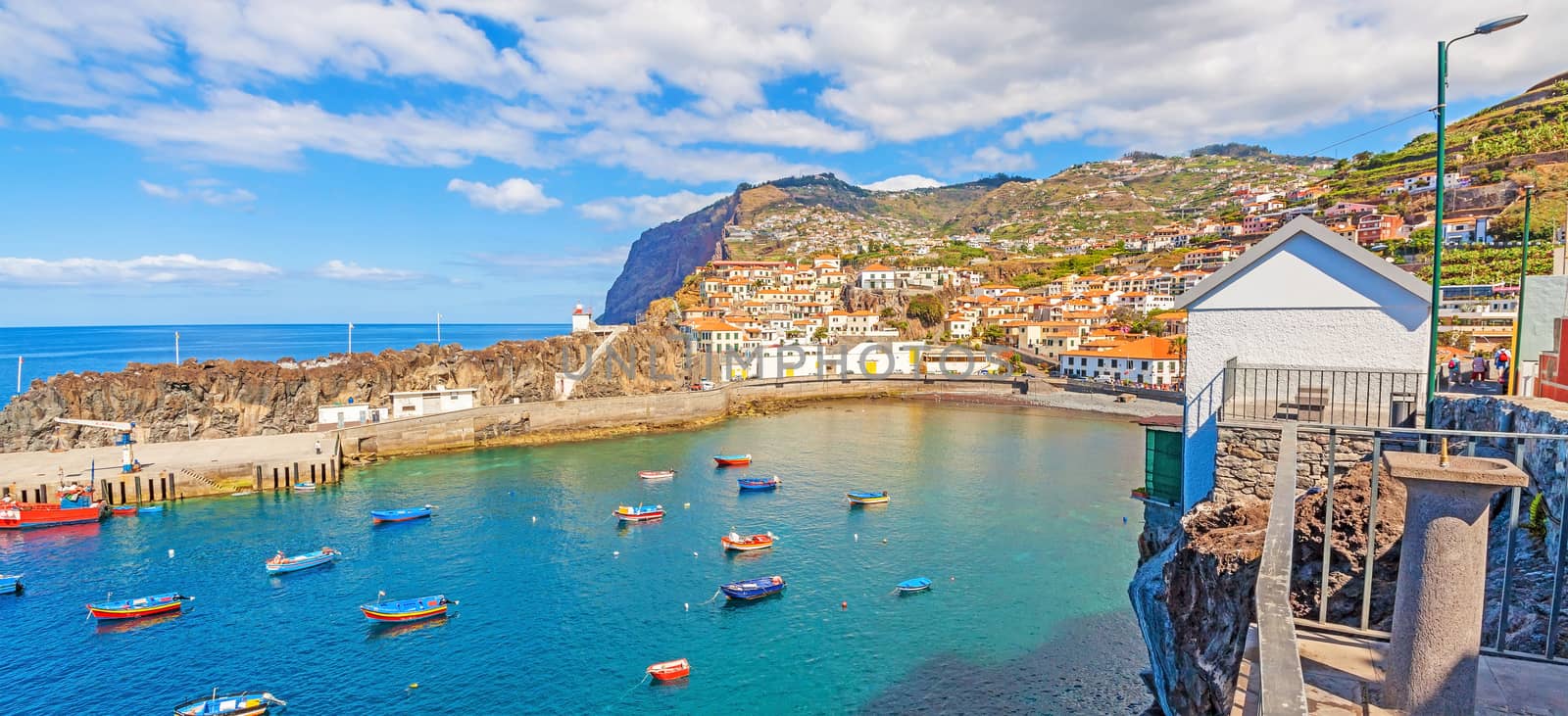 Camara de Lobos, Madeira - June 8, 2013: Panorama of Port / bay with fishing boats. The village is typical for its cat shark drying under the sun.