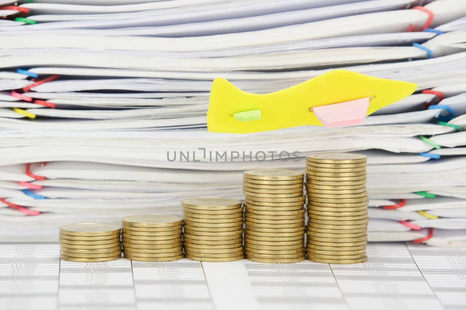 Airplane fly on step pile of gold coins on finance account  have stack overload document of receipt and report with colorful paperclip as background.