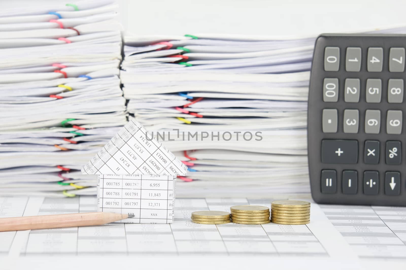 Pencil and house with step pile of gold coins by eaglesky