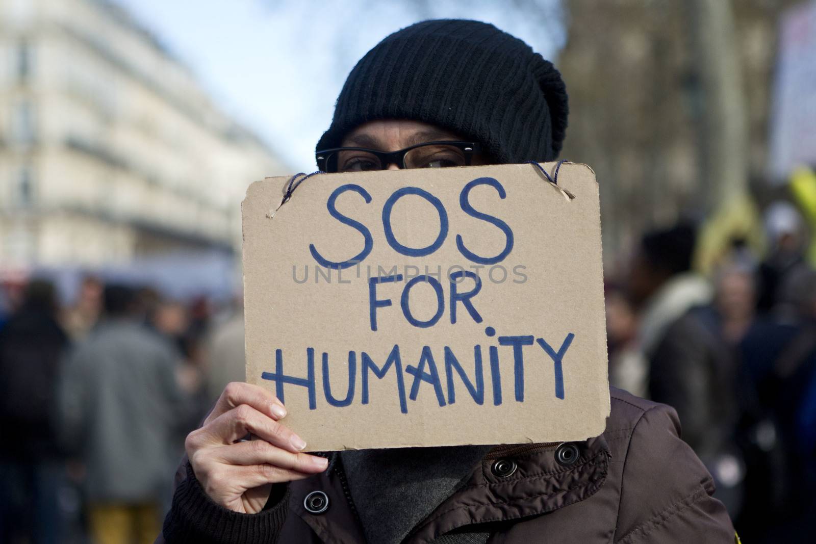 FRANCE, Paris: A woman holds a sign as hundreds of protesters gather on the Place de La Republique in Paris as part of demonstrations by the Nuit Debout (Up All Night) movement, on April 11, 2016. French Prime Minister Manuel Valls unveiled measures to help young people find work, aiming to quell weeks of protests against the government's proposed reforms to labour laws. Young people have been at the forefront of mass demonstrations against the reforms over the past month, which the government argues are aimed at making France's rigid labour market more flexible.