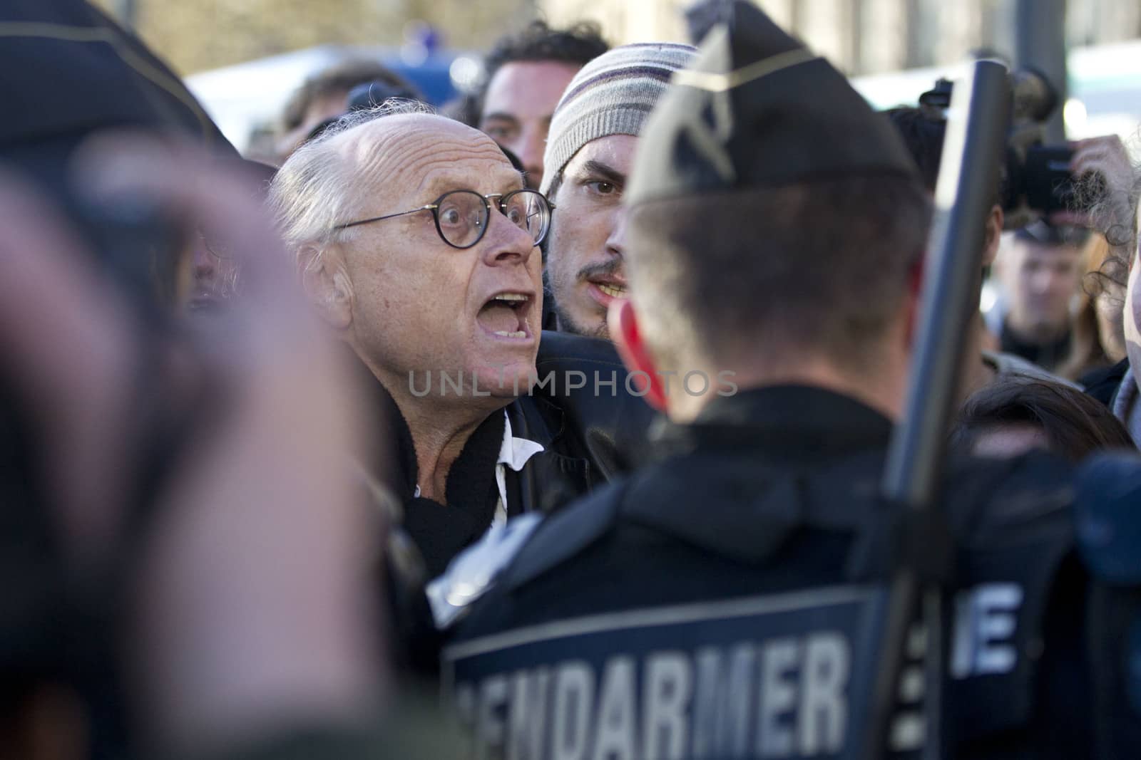 FRANCE, Paris: A man clashes with riot police during a rally held on the Place de La Republique in Paris as part of demonstrations by the Nuit Debout (Up All Night) movement, on April 11, 2016. French Prime Minister Manuel Valls unveiled measures to help young people find work, aiming to quell weeks of protests against the government's proposed reforms to labour laws. Young people have been at the forefront of mass demonstrations against the reforms over the past month, which the government argues are aimed at making France's rigid labour market more flexible.