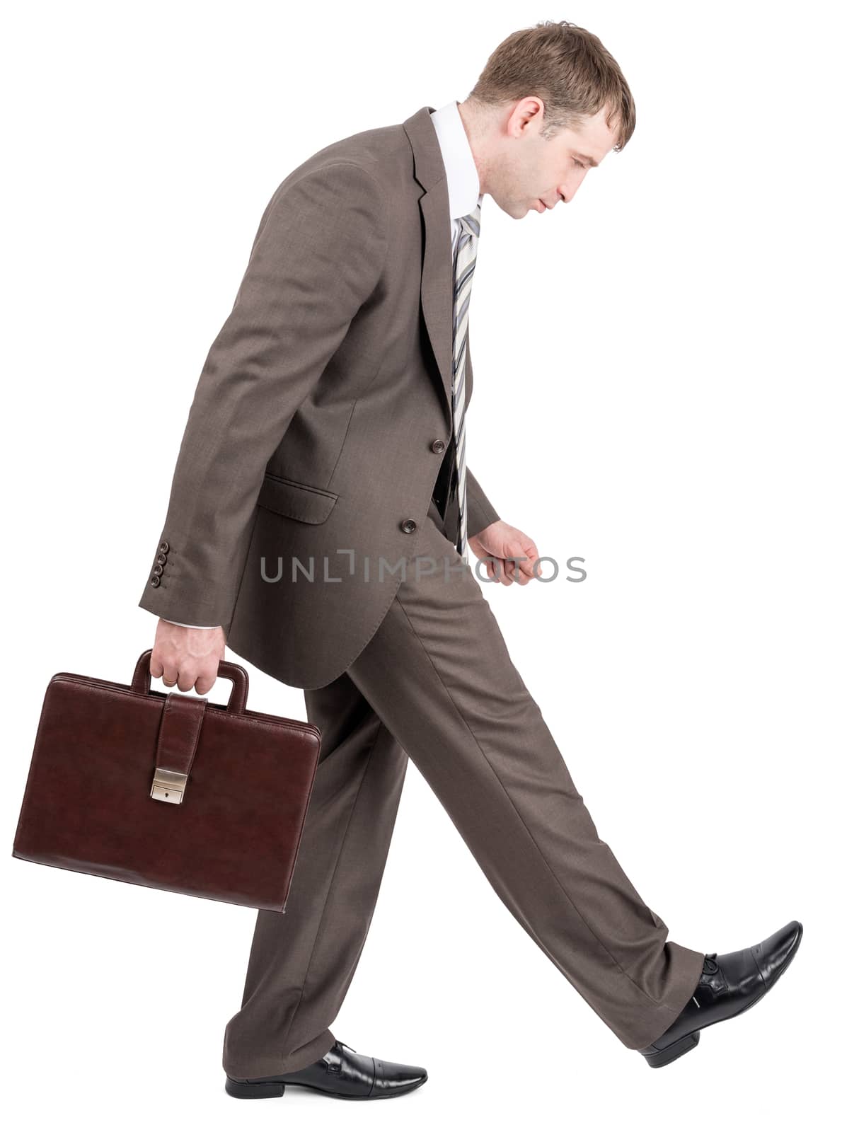 Sad businessman walking by isolated on white background