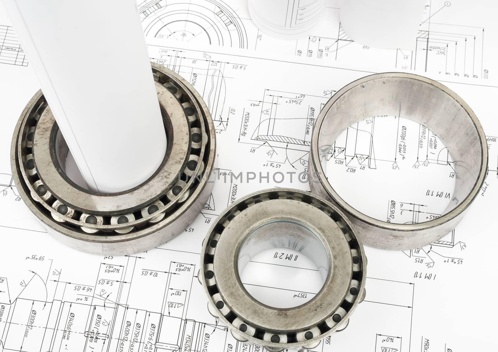 Architecture plan and rolls of blueprints with metal rings, top view. Building concept