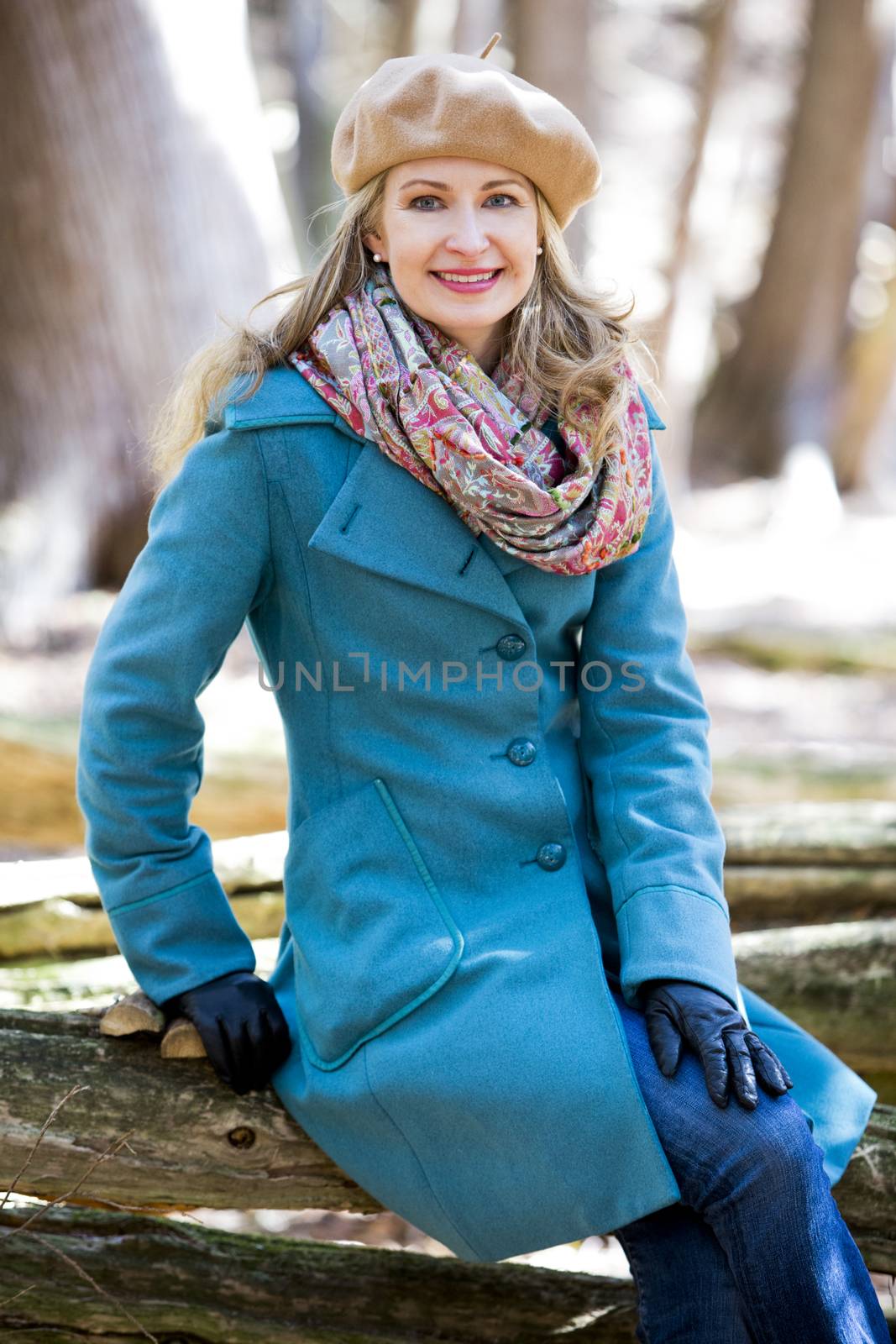 blond casual woman happy outdoors in the woods