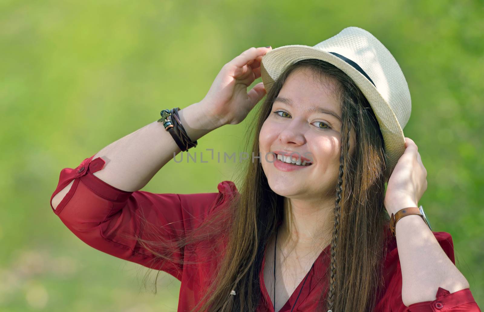 portrait of girl with hat in nature