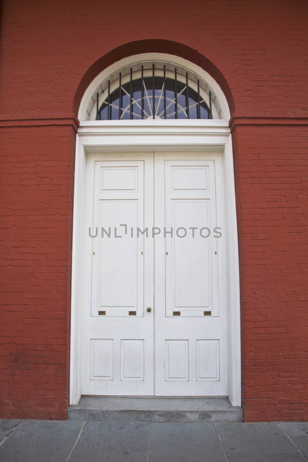 White door, red building in New Orleans, Louisiana, USA