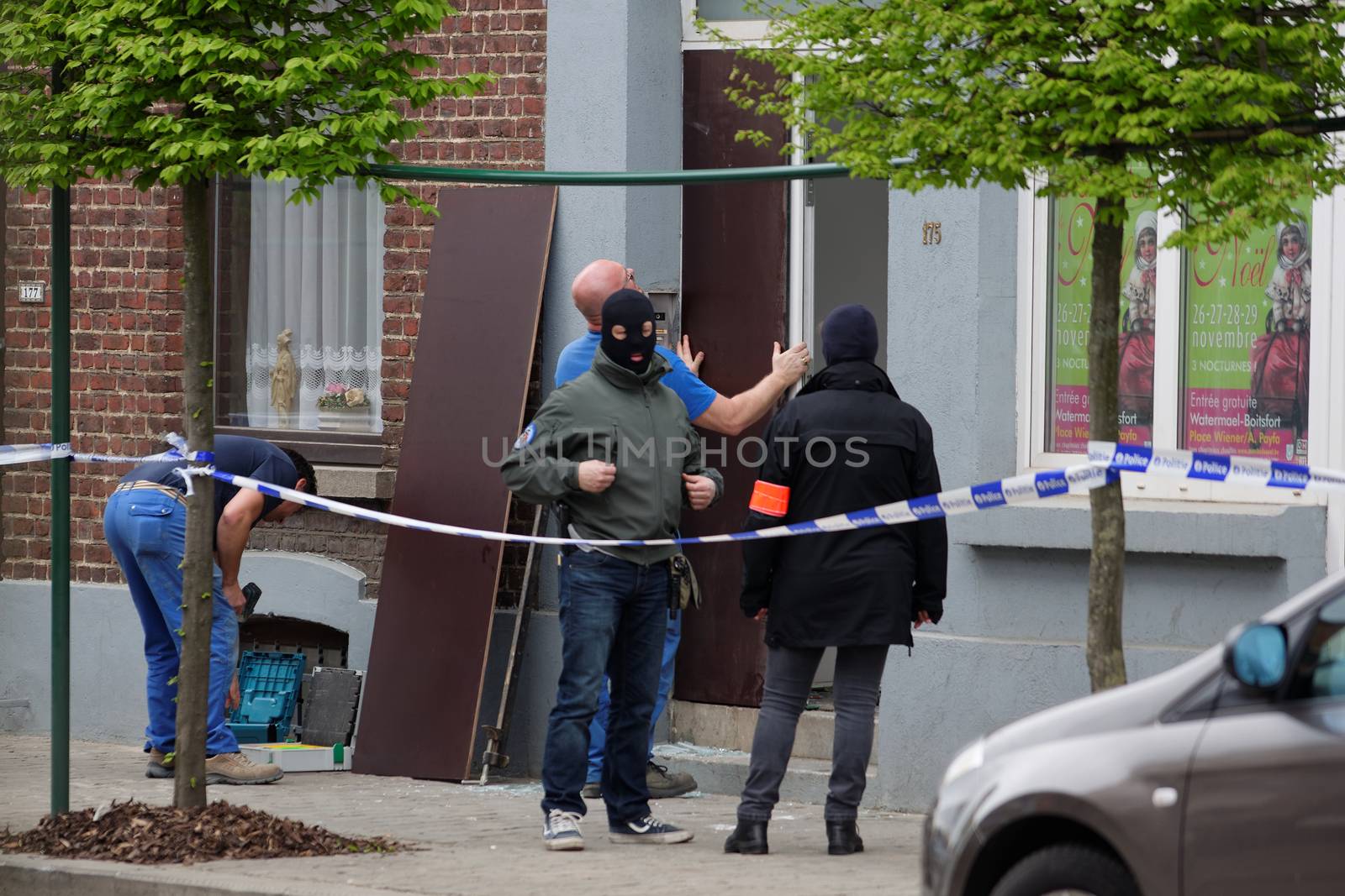 BELGIUM, Brussels: Belgian police are pictured outside a house searched in Uccle, a Brussels' municipality, on April 12, 2016. Three people have been arrested during this new raid linked to the investigation into the November Paris attacks, federal prosecutors said.