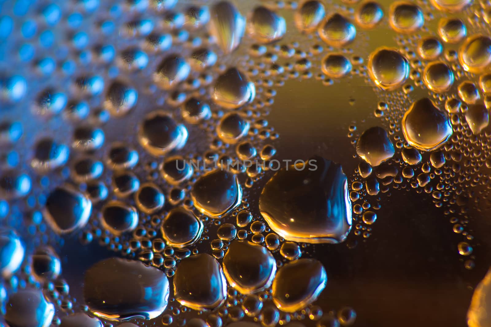 water drops on blue and orange background by skrotov