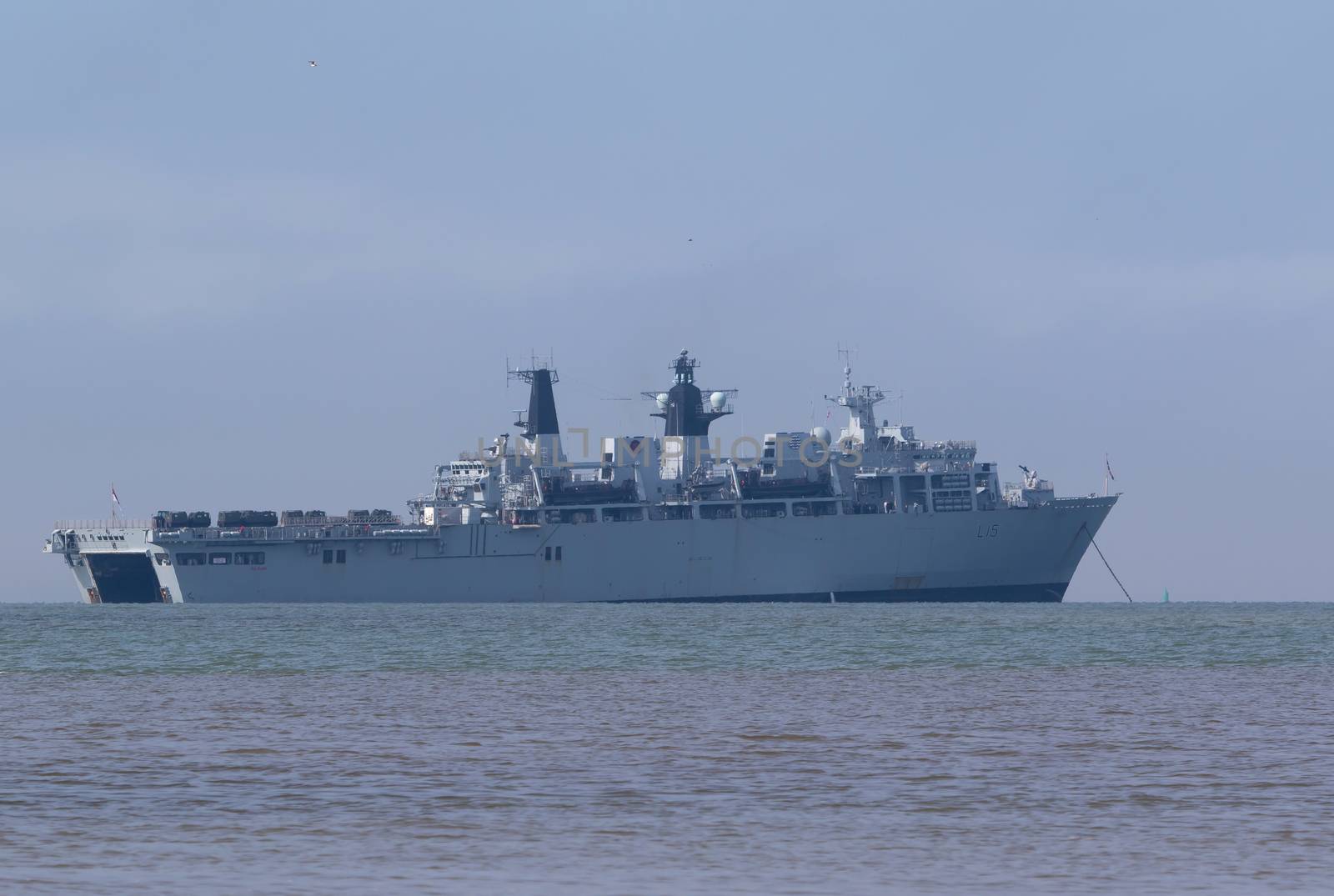 UNITED KINGDOM, Gosport, Hampshire: A ship waits off shore as part of Griffin Strike exercise on April 12, 2016.British and French troops came ashore in a dramatic display that attracted the attention those on the beach. The exercise is a culmination of years of naval cooperation between the two nations, and is intended to test the partnership and readiness between the countries.