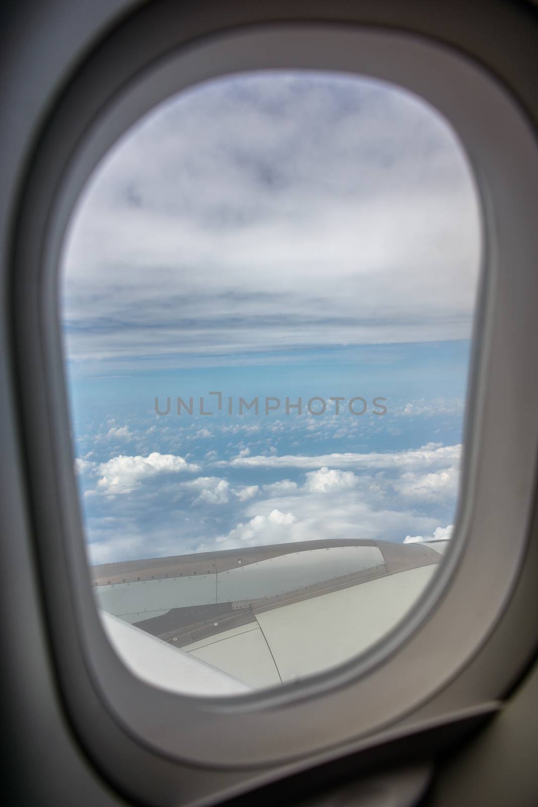 Airplane window by dutourdumonde