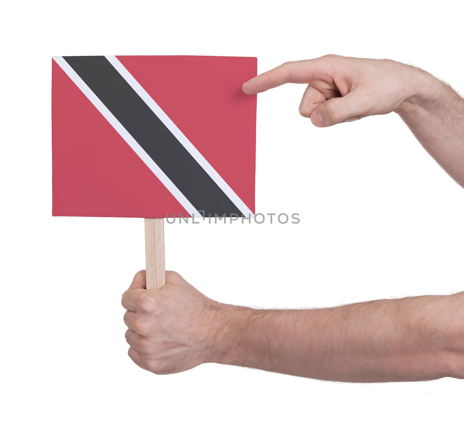 Hand holding small card, isolated on white - Flag of Trinidad and Tobago