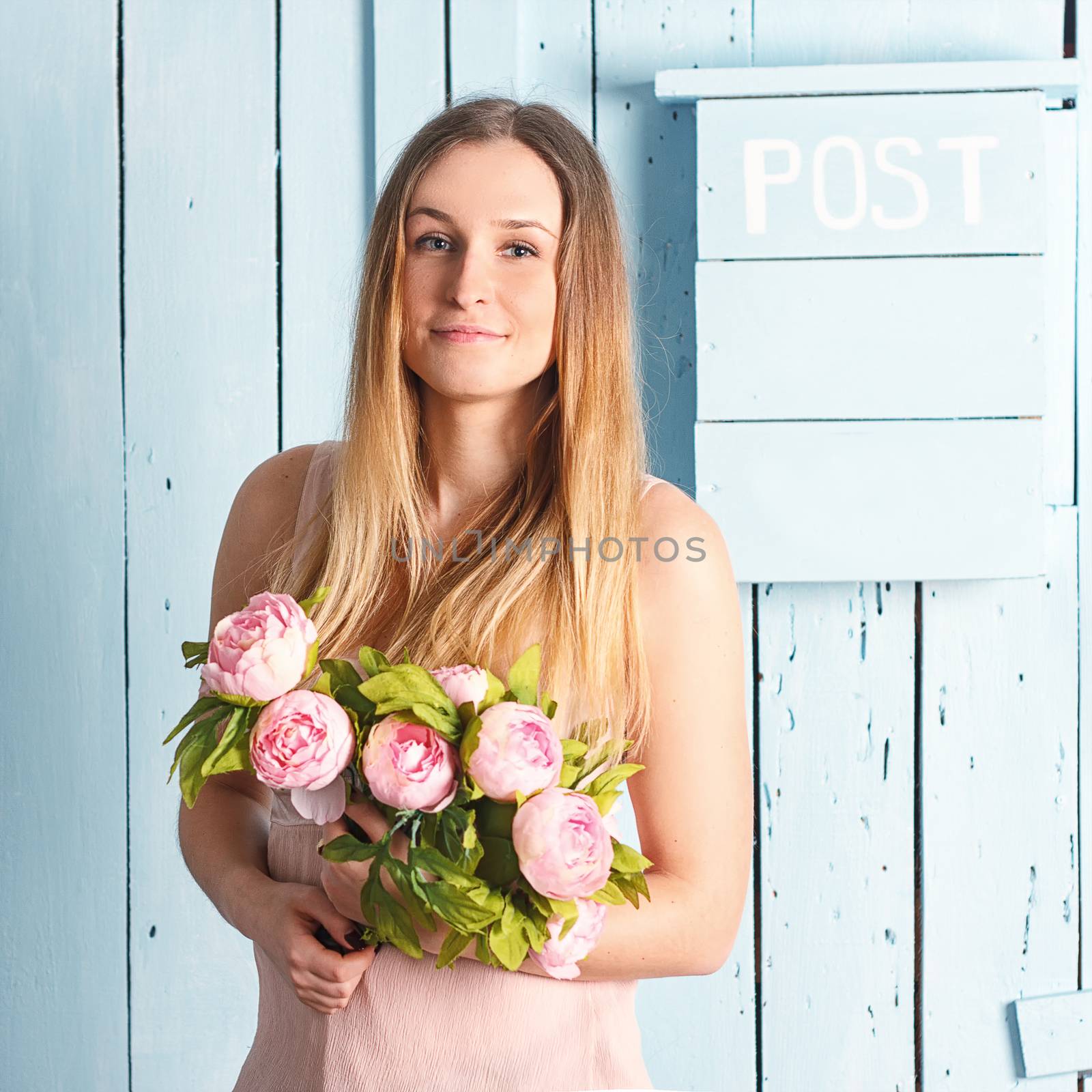 beautiful sexy stylish young adult in lingerie with nice bouquet of pale pink peonies